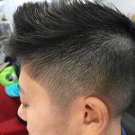 Image of a haircut: faded sides, scissor cut on top