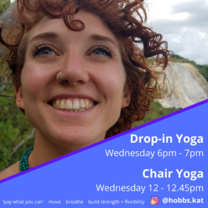 A photo of Kat Hobbs looking up to the sky and smiling. Kat has red curly hair, blue eyes and a nose piercing. Kat is outside in a rural landscape. The bottom right corner is obscured by a blue triangular shape which states: Drop-in Yoga, Wednesday 6pm - 7pm. Chair Yoga, Wednesday 12 - 12.45pm. Pay what you can, move, breathe, build strength + flexibility and the instagram handle @hobbs.kat