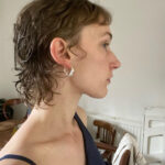 a picture of a short-ish curly hair cut